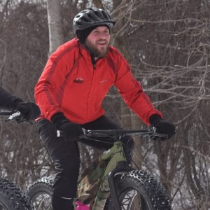 Here in the bike pic, a cyclist finds winter bike riding can be fun when commuting in the Anoka, County Area of the Twin Cities Metro.