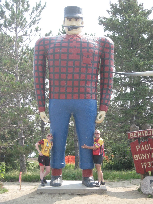 Headwaters to Hills Bike Riders posing with Paul Bunyan and Babe on the 2015 tour.