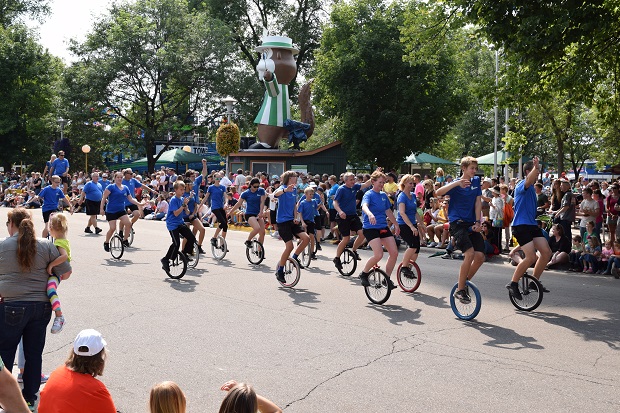At the Minnesota State Fair parade, its fun to see the uni-cyclists riding among the floats and marching bands.