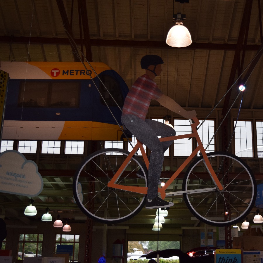 At the Minnesota State Fair , check out the new Kick Gas exhibit with the “World’s Biggest Bike” hanging from the ceiling in the Eco building.