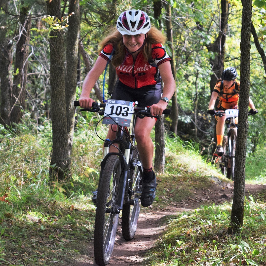 Miles of Smiles Sunday on the mountain biking Jail Trail highlights the fun of cycling. Here in this photo, a team member of Stillwater High School is having fun on the mountain bike course on the east side of St Cloud, Minnesota.