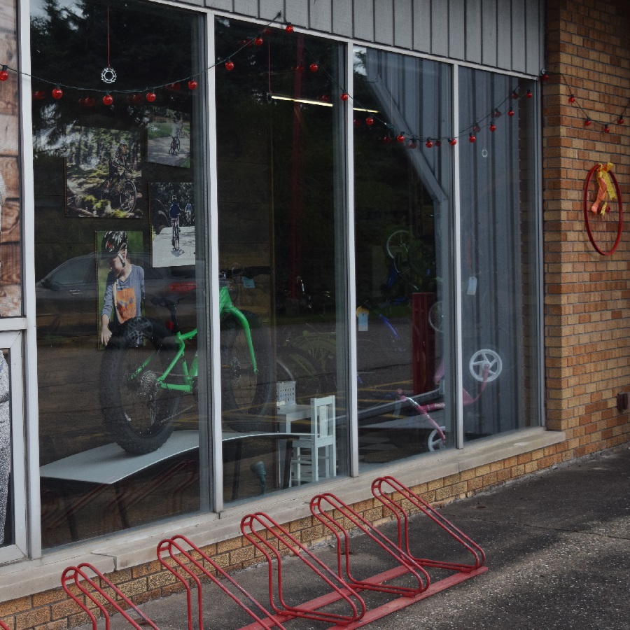 A friendly bike shop store front that invites you in. 