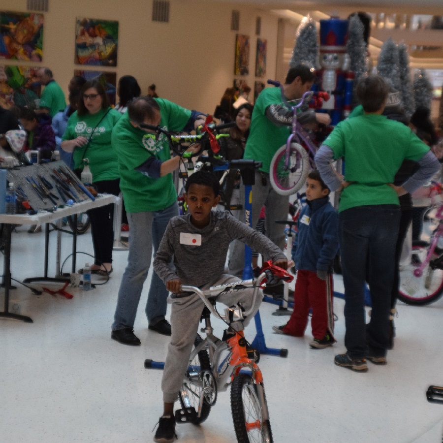 Here the Free Bikes 4 Kidz crew is putting finishing touches and sizing the bike as they roll out of the Male of America.