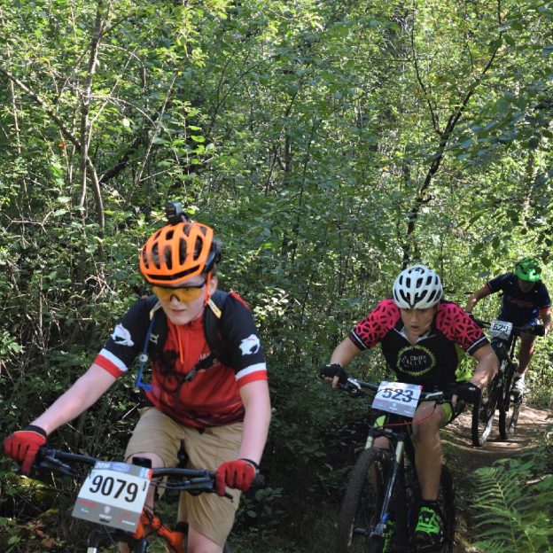 Here in this bike pic, a pack of Crank Sisters from the Minnesota High School Cycling League testing their mountain bike skills on the Jail Trail, near St Cloud, MN.