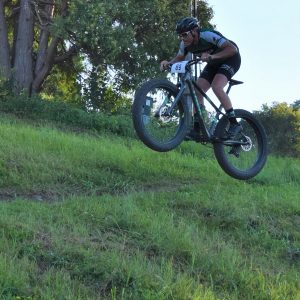 This Wheelie Wednesday, Bike Pic June 20th and the last day of spring, take a chance! If life were a mountain bike trail a wheelie could help smooth out your day-to-day ride. Also, are you ready to rumble for Penn Cycle’s Thursday Night Mountain Bike Races, at Buck Hill in Burnsville, MN, tomorrow night?