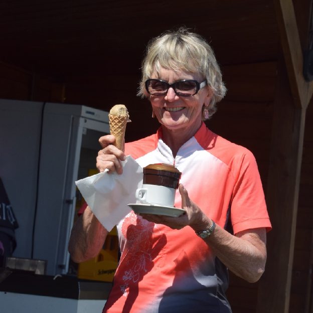 Its Ice Cream Smiles Sunday, in the Netherlands and this chick stops to enjoy a creamy cool treat and a cup of coffee before resuming her bicycle ride.