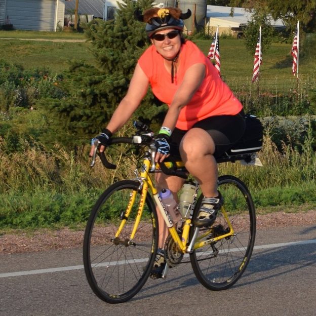 Here is another bicycle rider having fun, pedaling into the morning sun on a picture perfect day riding out of Orange City, IA, on RAGBRAI 2017.
