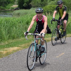 Many Cyclists riding around Albert Lea Lake enjoyable