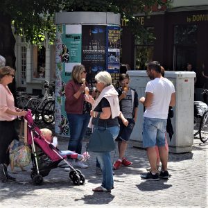 Its Ice Cream Smiles Sunday around the world and here in Brugge, family and friends gather in the public square.