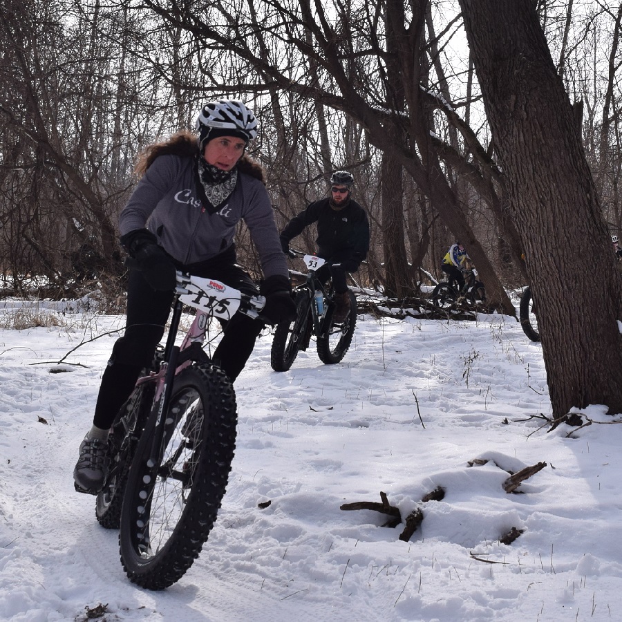 With below normal temps snow is sticking throughout the upper half of Minnesota making it perfect for some fat bike fun as this biker chick demonstrates.