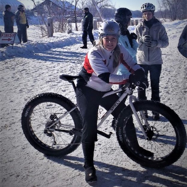 Winter fat bike fun is back in the upper Midwest as this biker takes a break for this photo opp.