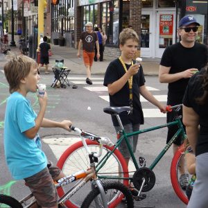 Its ice cream smiles Sunday around the world and here in the united States, at an Open Streets Minneapolis these young biker dudes are enjoying a cool treat