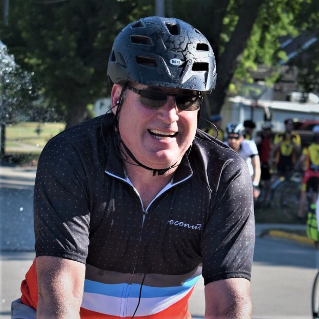 Here in today's bike pic we dig back to a previous RAGBRAi and show this biker dude cooling off, under a spray nozzle, as he entered one of the communities along the route. What a fun way to bike across Iowa!