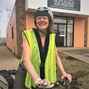 Kay Peterson, in front of Winona Volunteer Services