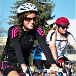 Riding into the Monday morning sun as our beautiful  spring weather continues. Today's photo was taken in Lakeville, MN as this biker chick was having a great time with a friend pedaling the town.