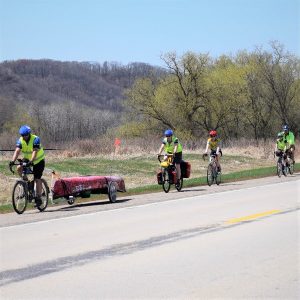 It isn't every day you see a peloton of touring cyclists towing a canoe down the Mississippi River Trail (Hwy 61). Here Amy & Dave and crew enjoy a tailwind south of Red Wing, MN.