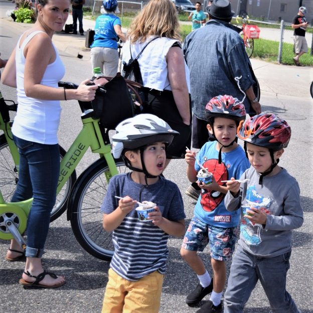 Its a picture perfect day and ice cream smiles Sunday is around the world. Here in Minnesota, at an Opens Street Minneapolis Event, these young bikers are a bit envious of each others flavor choices.