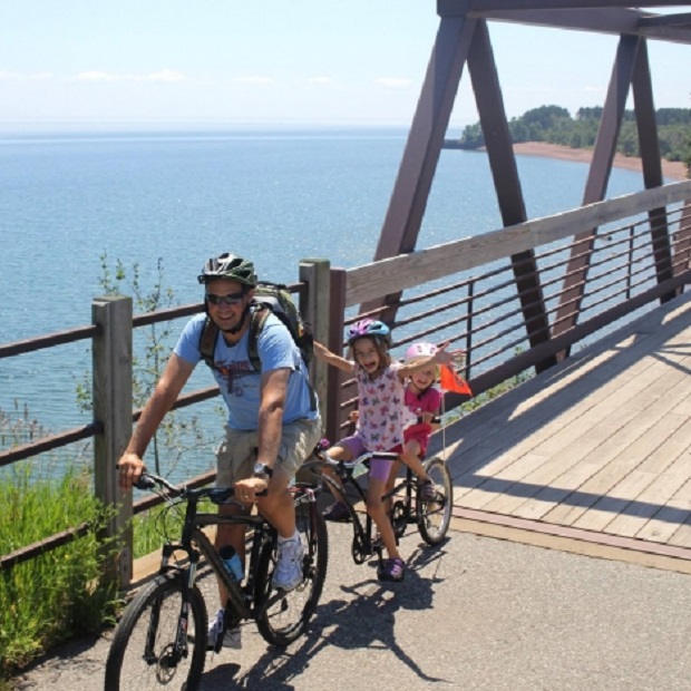 Riders on the18th Annual Gitchi-Gami Trail Association North Shore Bike Ride, August 18, will enjoy shoreline views of Lake Superior as they pass through a state park or riding over a serenading waterfall as it cascades into the lake.