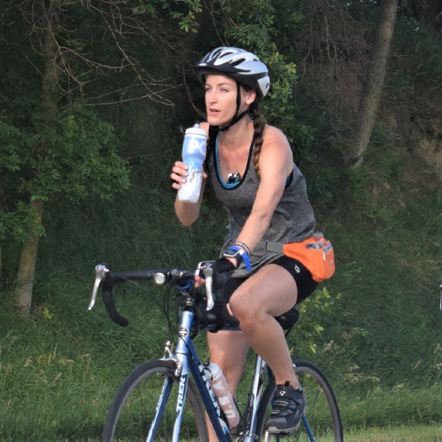 In hot weather stay hydrated by taking a few sips of water every few miles.