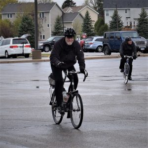 Here in this bike pic Tuesday we found the cyclists riding in wet weather, though still smiling.