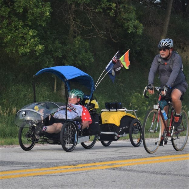 Here in this bike pic, we captured these biker dudes, one with an electric assist recumbent tricycle having fun pedaling into the Monday morning sun, riding across Iowa.