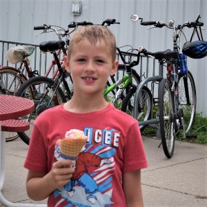 On this bike pic Sunday, we found this young biker dude enjoying a tasty treat on a  stop at a local shop with friends.