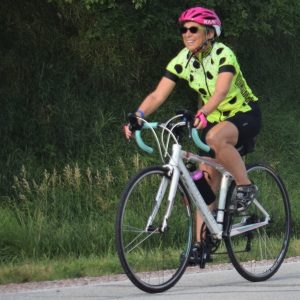 Here in this bike pic, we captured a biker chick having fun pedaling into the Monday morning sun, riding across Iowa.