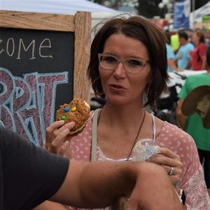 On this bike pic Sunday, digging through the archives we found this biker chick in heaven enjoying an ice cream sandwich after a hard days ride. What's better than bicycles and ice cream?  This picture was shot on the 2017 RAGBRAI  bike tour.