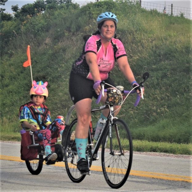 Here in this bike pic, digging through our summer archives, we captured this family bonding moment as they pedaled across Iowa. See more fun photos on the RAGBRAI 2018 website.