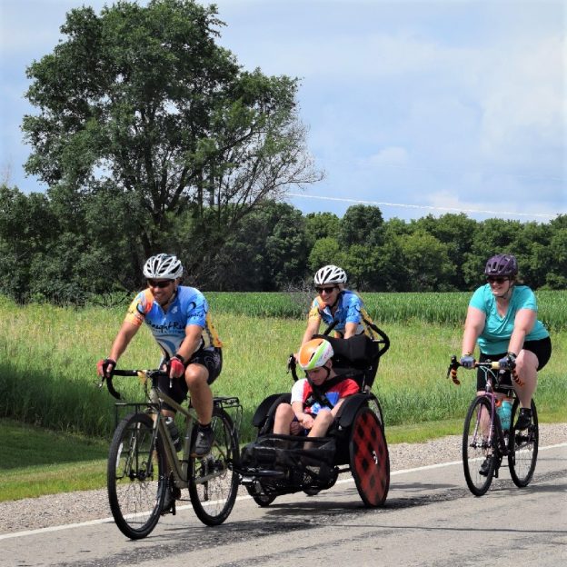 Here in this bike pic, digging through our summer archives, we captured this fun photo of a family enjoying time together on Rock-n-Roll the Lakes ride last summer in Albert Lea, MN.