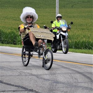 Here in this Saturday bike pic, looking through the summer archive, we captured this biker dude riding across Iowa, with a funky-fury hat.