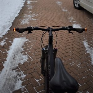 WingLights is an inexpensive blinker light system for bicycles to display a very visible directional turn signal at an intersections.