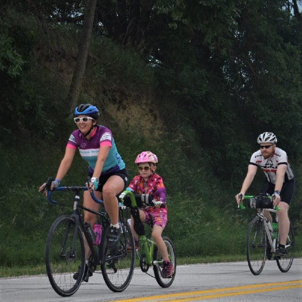Here in this Thursday bike pic, looking through the summer archive, we captured this family riding across Iowa, with with the sun shining brightly.