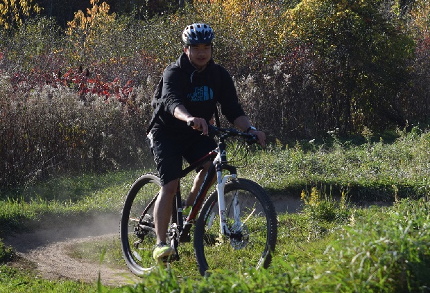 Here, Marcus Lea is out with friends enjoying a colorful day mountain biking in Lebanon Park, in Eagan, MN.