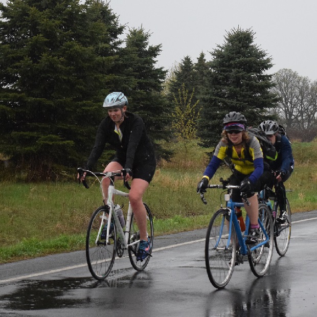 Having fun riding their bikes in the rain on the Minnesota Ironman's 50th Anniversary Ride.