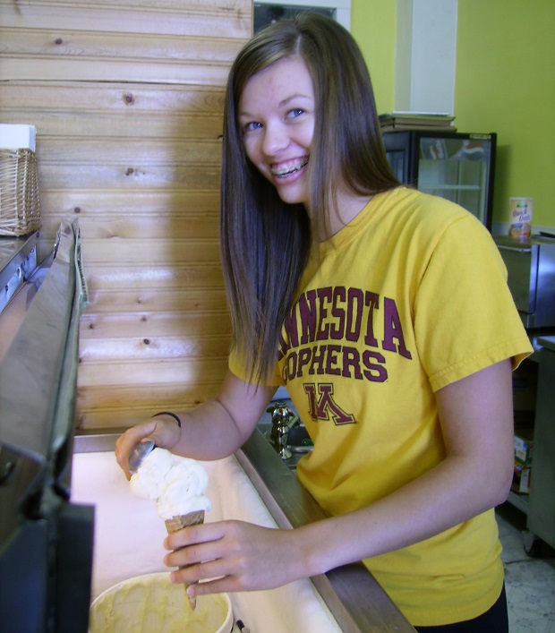 A smiling face serving ice cream at Geneva's on Main Street, in Peterson