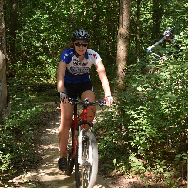 Here on her mountain bike is a MN High School Cycling League team member practicing in Lebanon Park, in Eagan, MN.