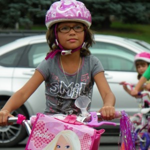 Here, this young lady shows off here new bike after finishing a bike rodeo at her school in Albert Lea, MN, this last summer.