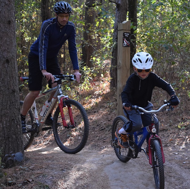 Here a father and son are out on a Mountain bike trail enjoying some quality time together. Photo taken on a trail near Lakeville, MN.